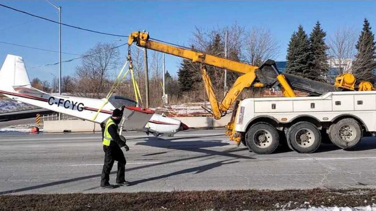 The plane being removed from the road.