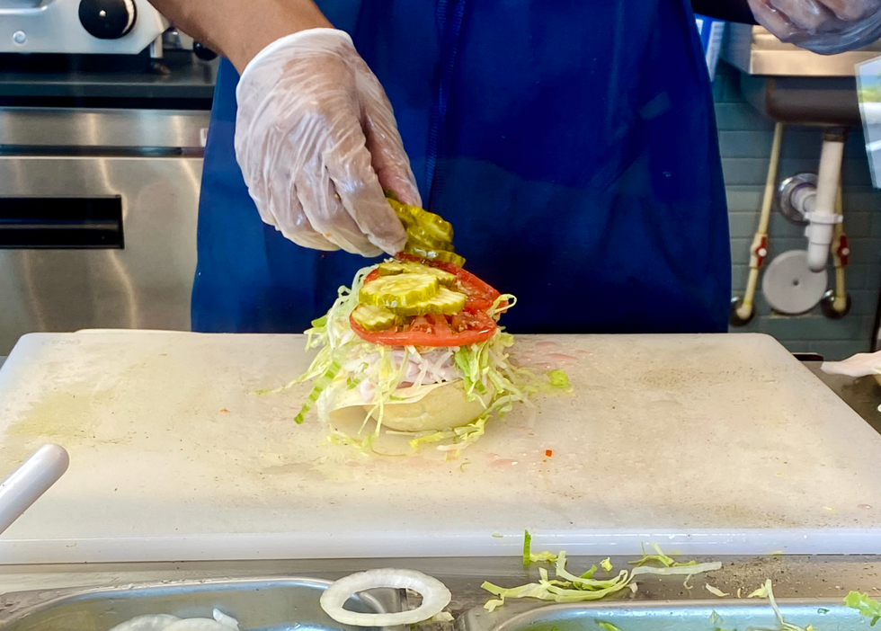 The sub making process at Jersey Mike's.