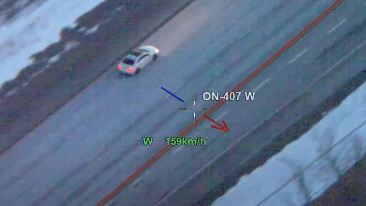The suspect vehicle driving down Highway 407.