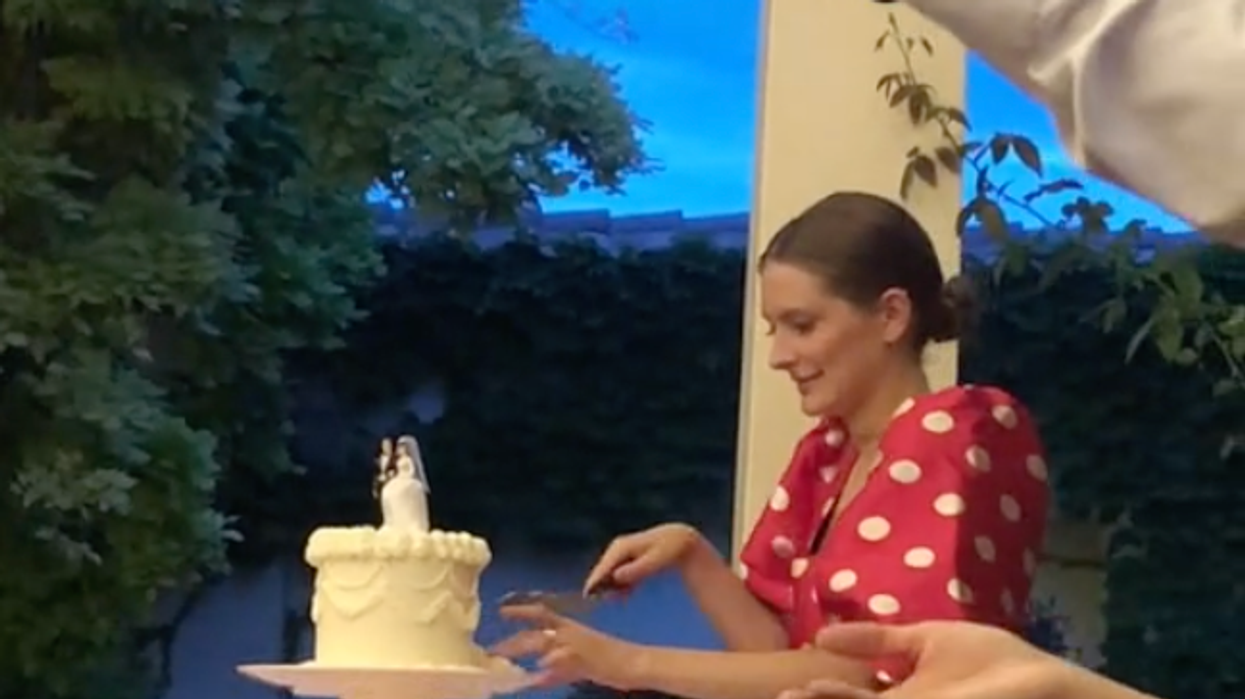 The TikToker cutting the wedding cake.