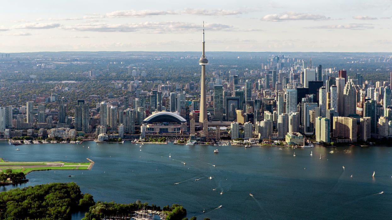 The Toronto skyline with Lake Ontario in the foreground.