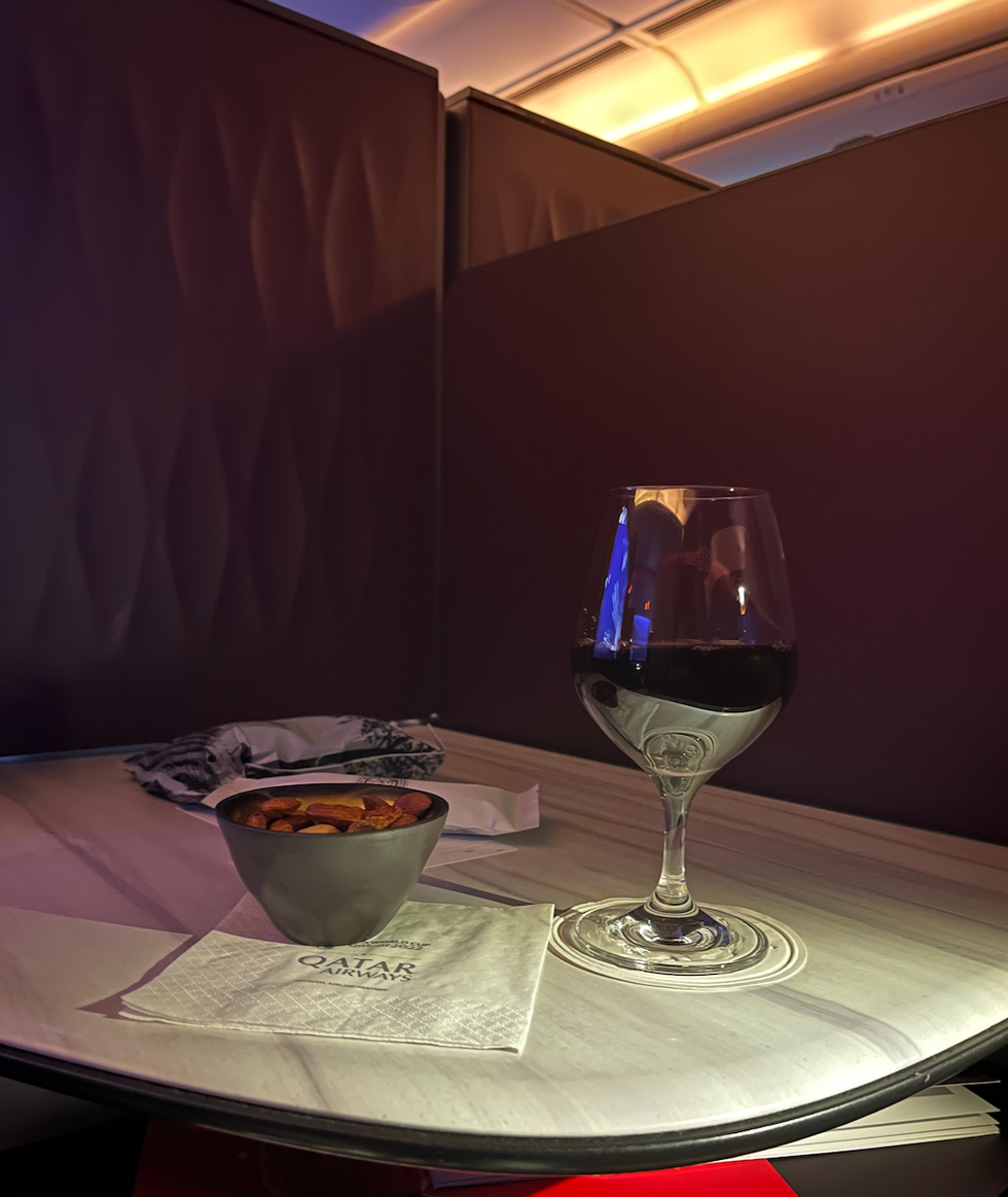 The warm mixed nuts and wine served to me on Qatar Airways business class.