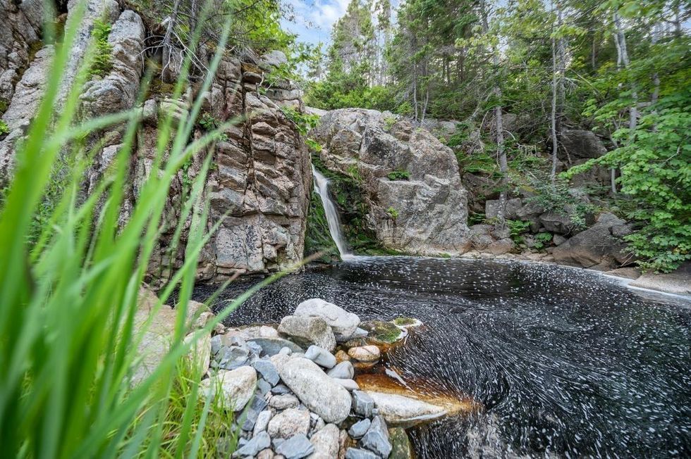 The waterfall that's located on the property.