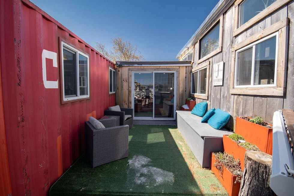 This $52K Tiny Ontario House Is A Portable Shipping Container & Has A Rock Climbing Wall