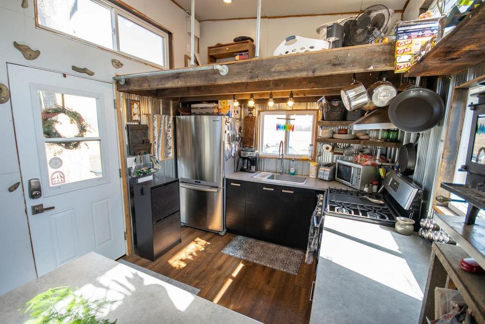 This $52K Tiny Ontario House Is A Portable Shipping Container & Has A Rock Climbing Wall