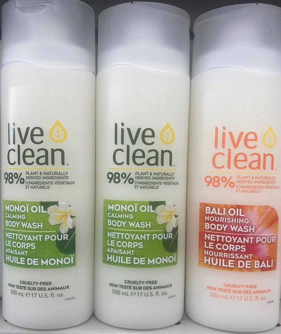 Three bottles of body wash on a store shelf.