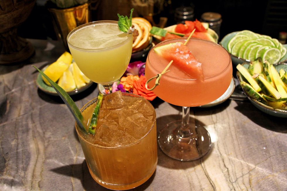 Three cocktails at the bar.