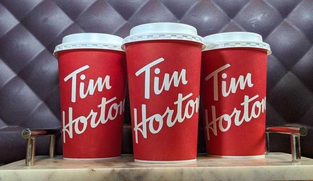 Three cups of Tim Hortons coffee in Sarah's home.