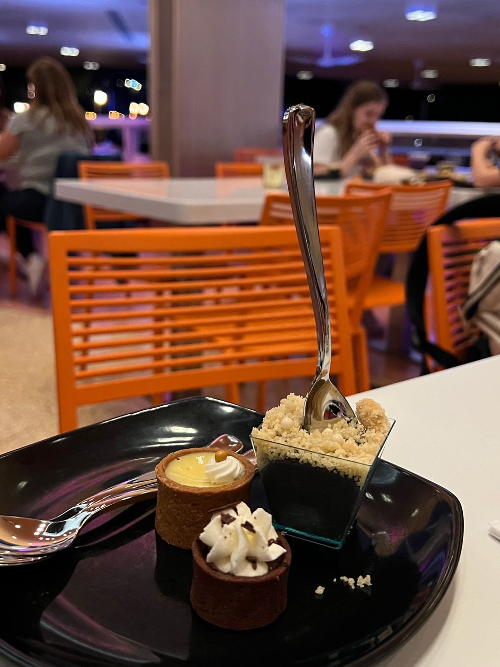 Three desserts on a plate.