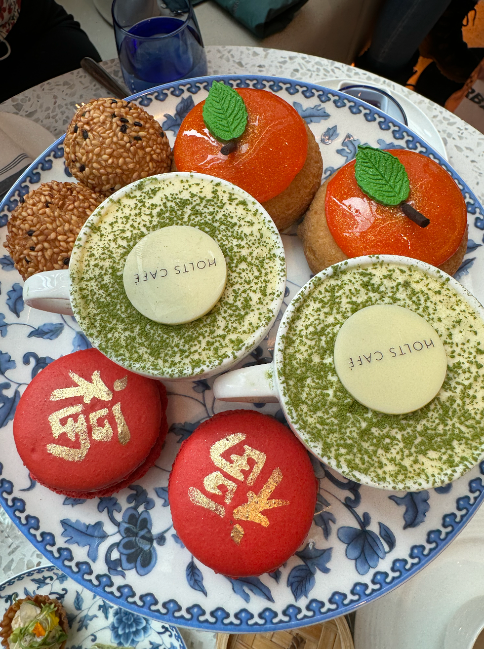 Three different desserts on a plate.