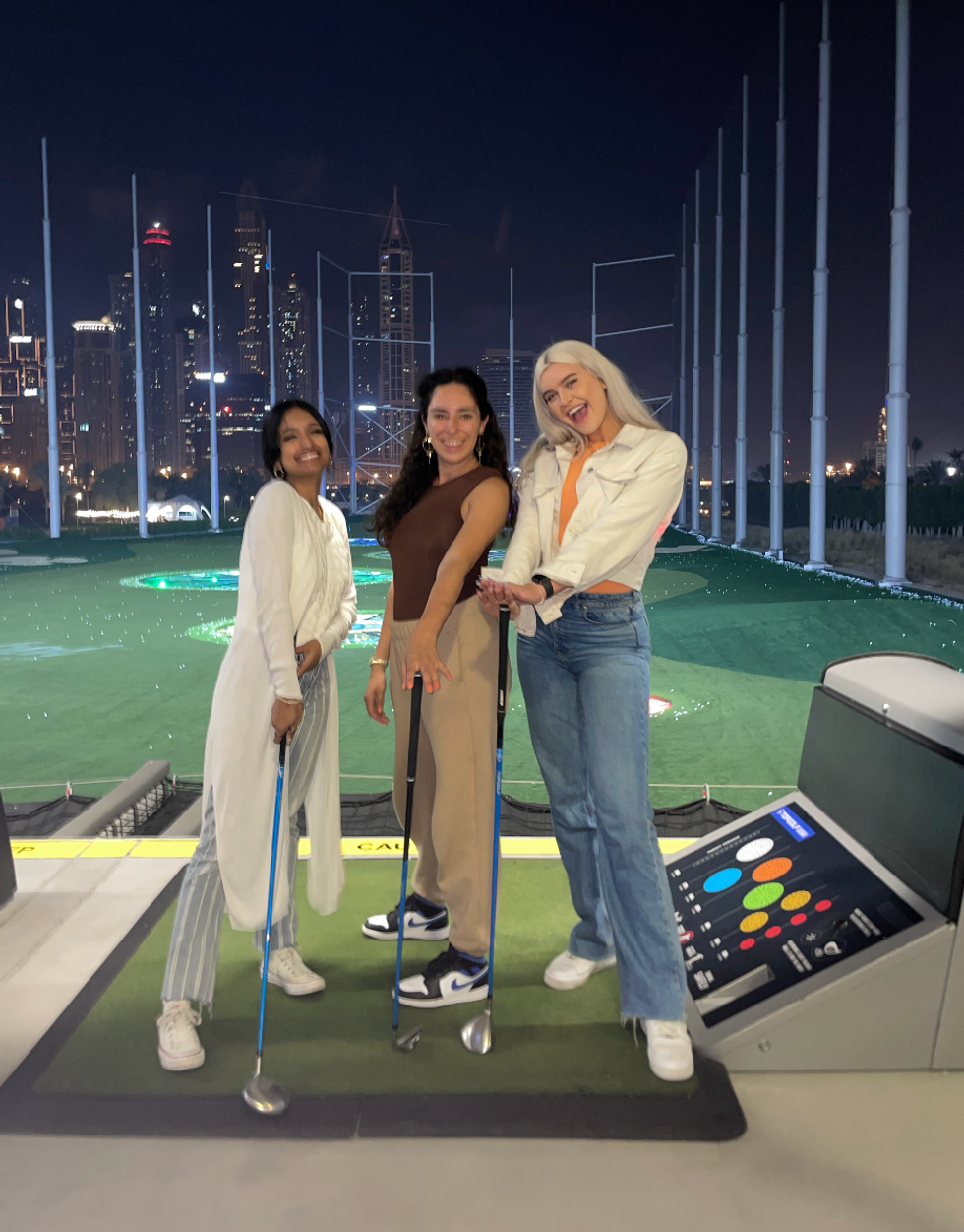 Three girlfriends at Topgolf in Dubai.