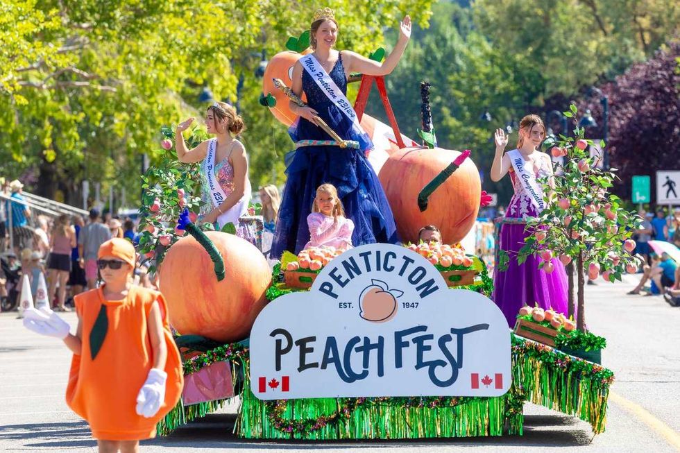 Three Miss Penticton winners wave to the crowd from the Penticton Peach Fest float.