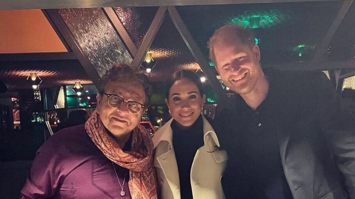 Three people smiling for a photo.
