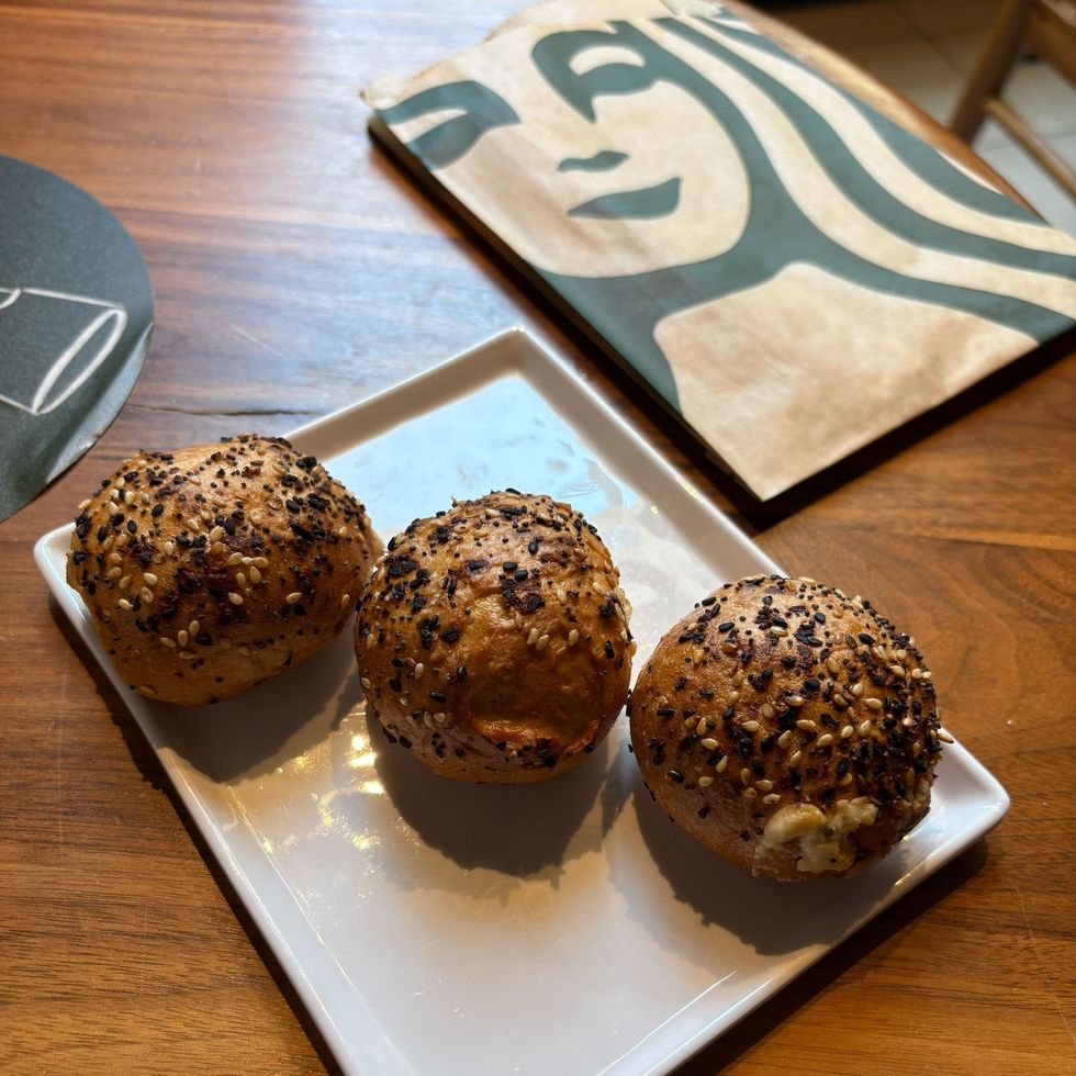 three starbucks mini everything bagels on a plate