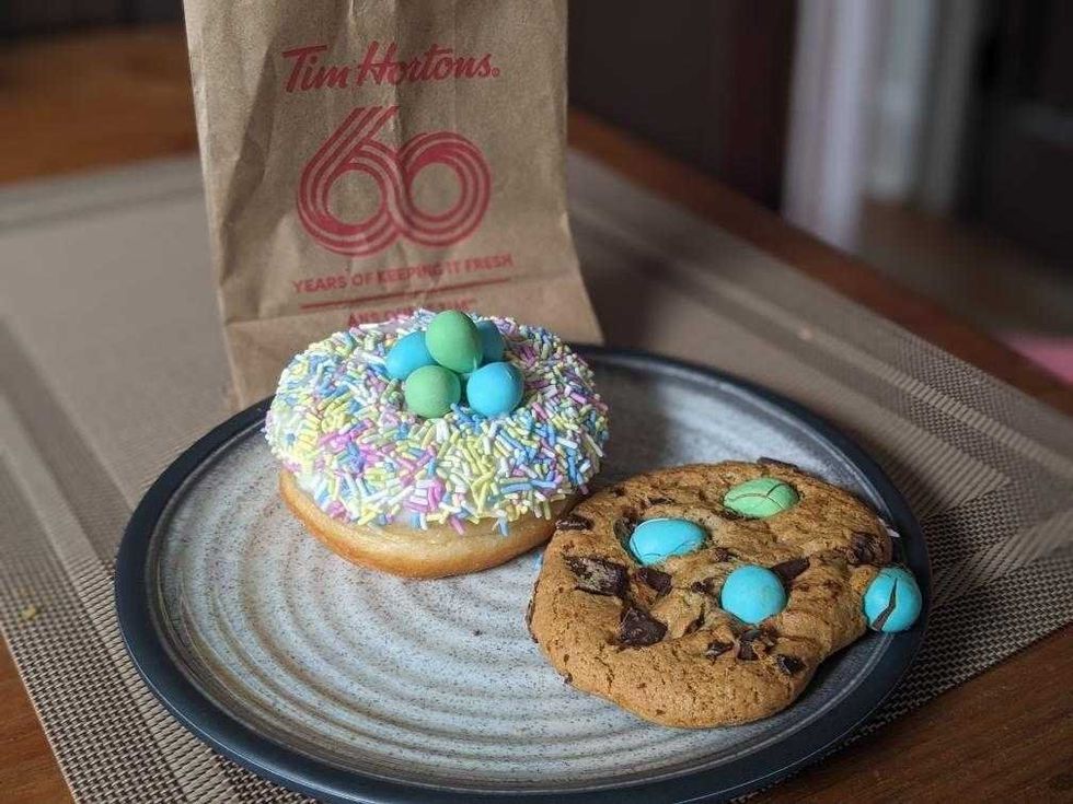 Tim Hortons Cadbury Mini Eggs Dream Donut and the Cadbury Mini Eggs Cookie on a plate.