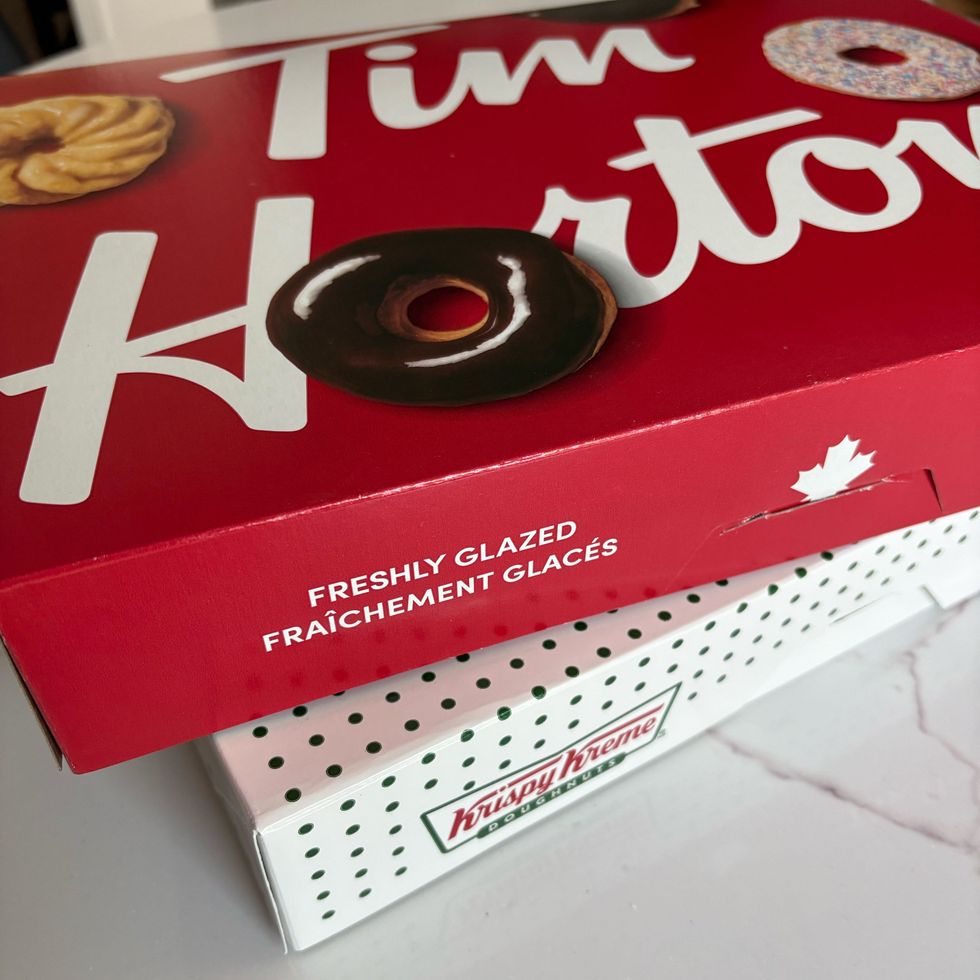 tim hortons donut box stacked on top of a krispy kreme donut box
