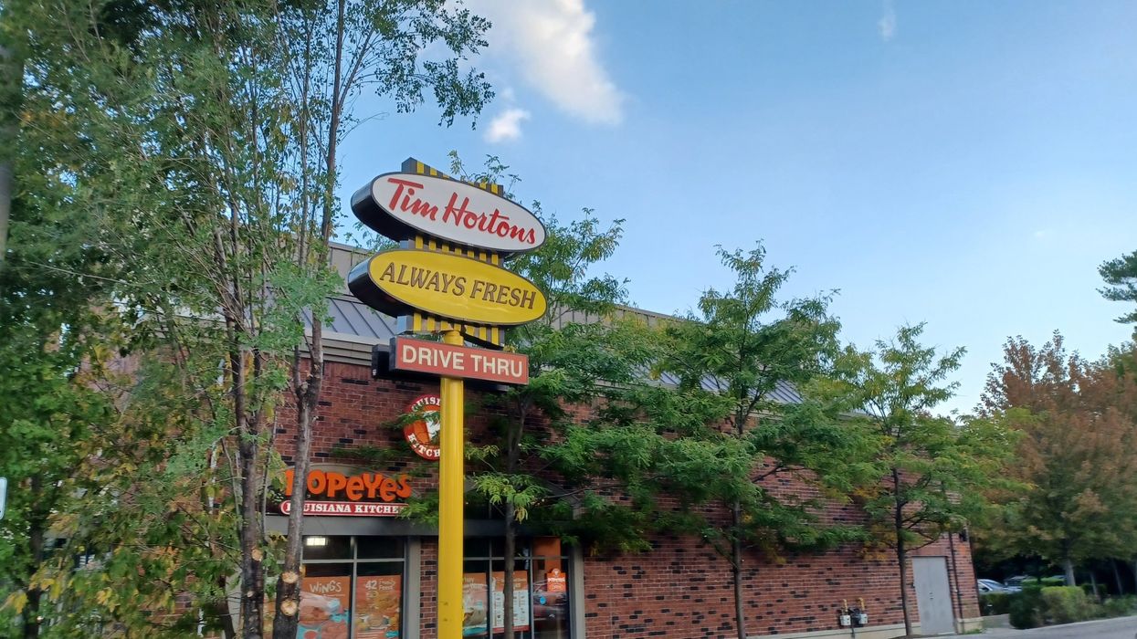 Tim Hortons drive-thru sign at a location in Toronto.