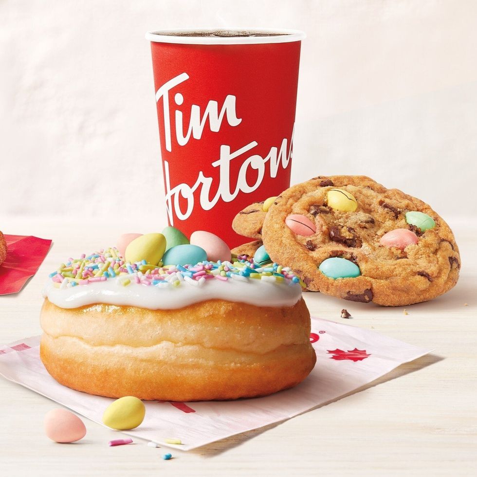 Tim Hortons Mini Eggs donut and Mini Eggs cookie with a cup of coffee