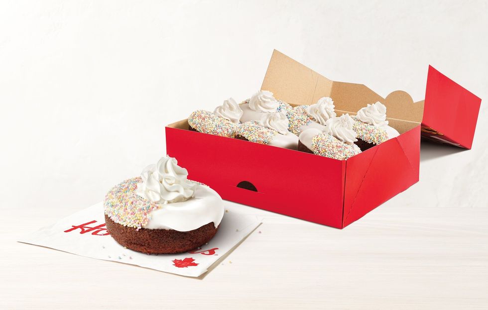 tim hortons special olympics donut on a napkin in front of a box of donuts