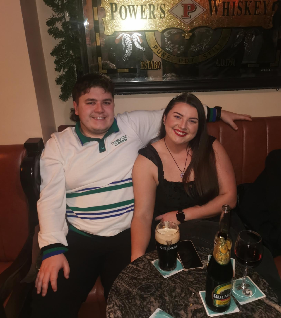 Tom\u00e1s Keating smiles with his partner.