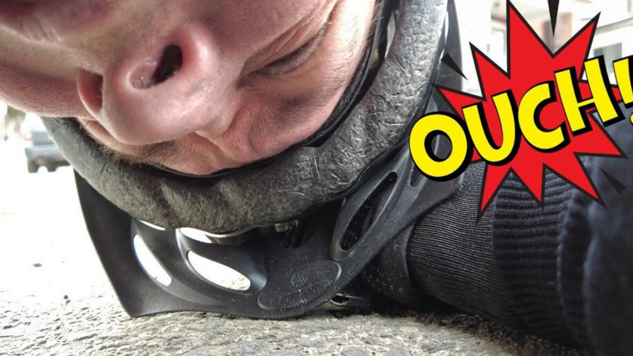 Toronto bike rider crashes after tire gets stuck in streetcar track.