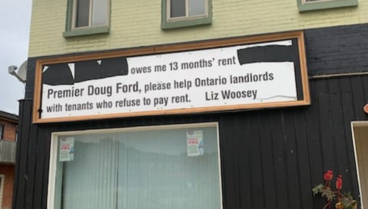 Toronto Landlord's Sign Demanding A Tenant Pay Rent Was Hung Up On His Building
