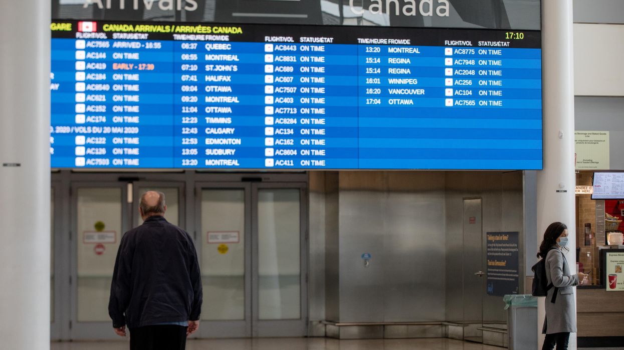 Toronto Pearson Airport flight board of scheduled arrivals.