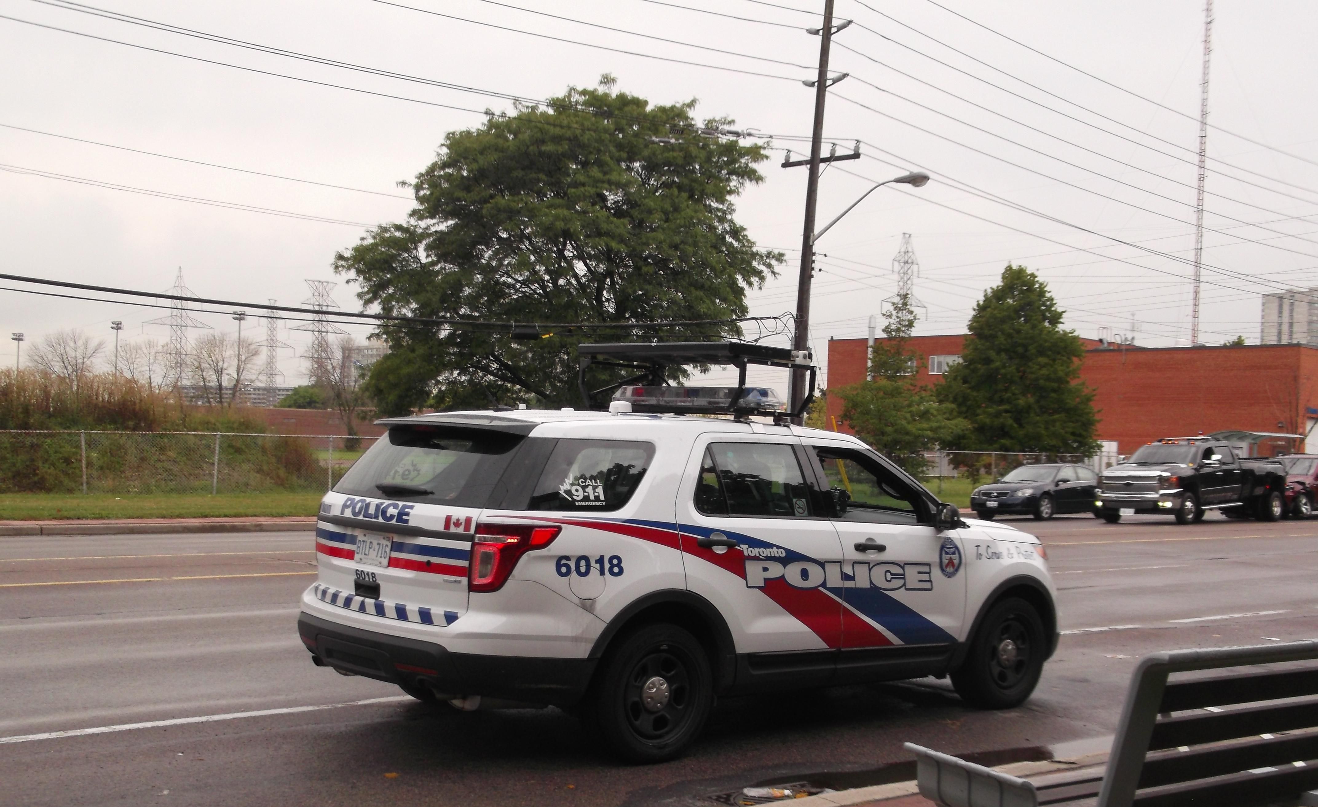 Toronto Police car on the road.