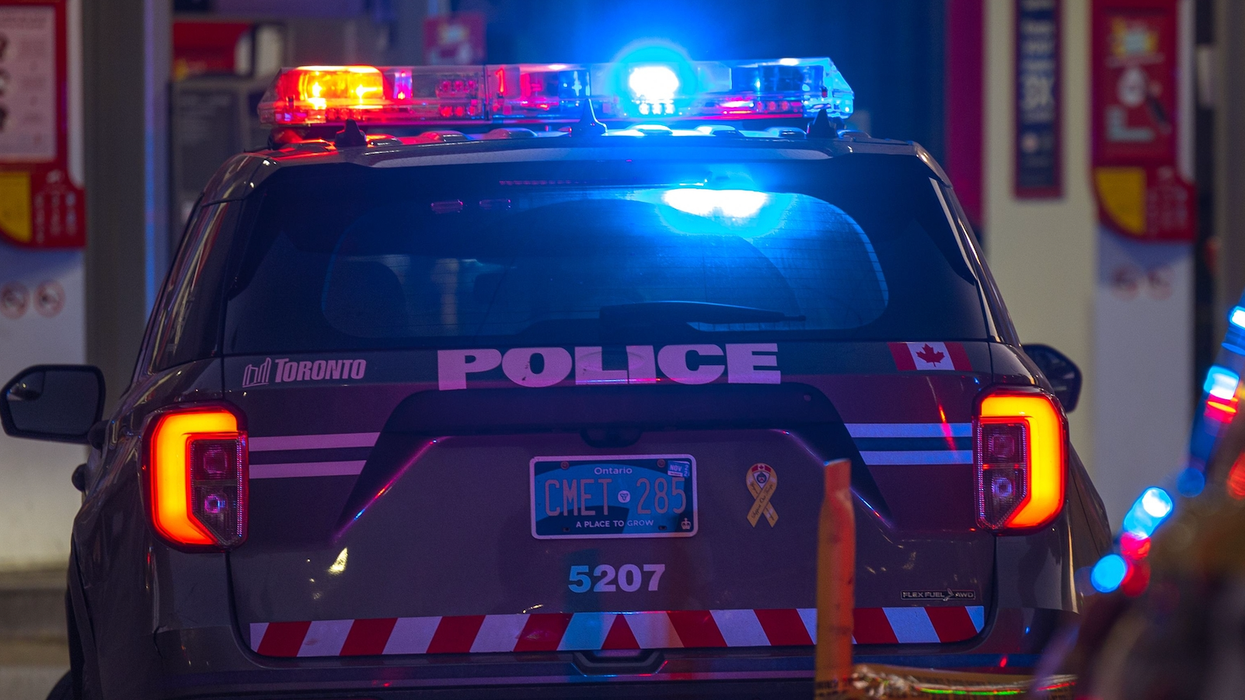 Toronto Police Ford Explorer parked at a crime scene with emergency lights activated.