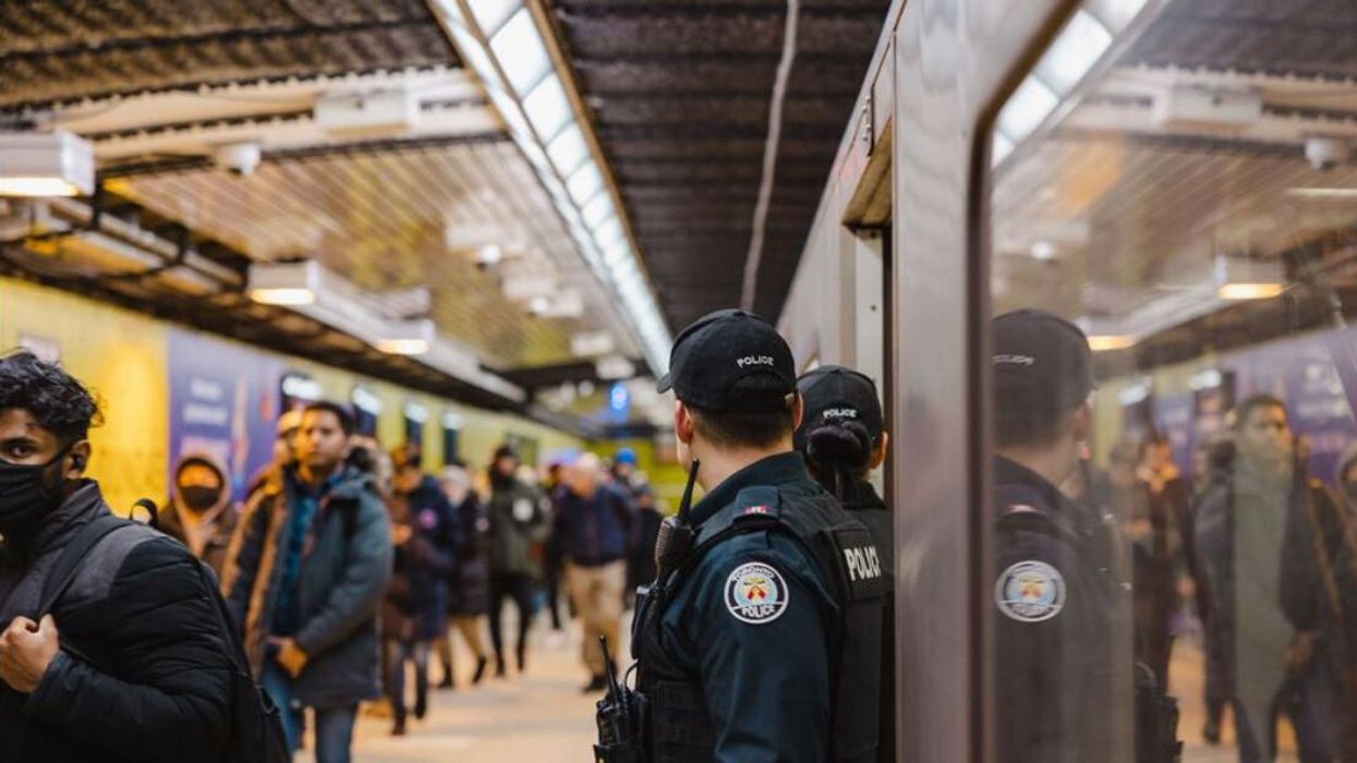Toronto Police officers on patrol at Dundas Station.