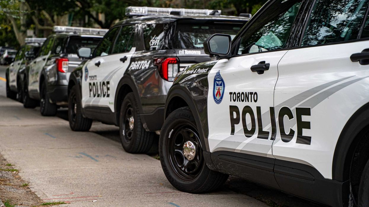 toronto police vehicles parked on a street