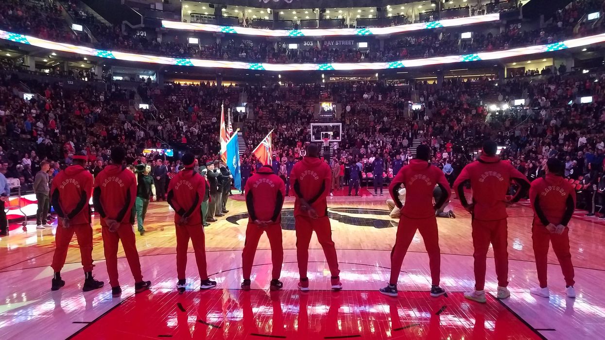 Toronto Raptors standing in the Scotiabank Arena.