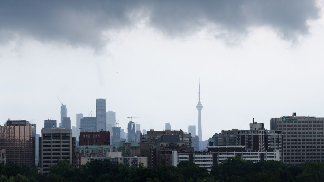 Toronto skyline on a gloomy, rainy day (illustrative).