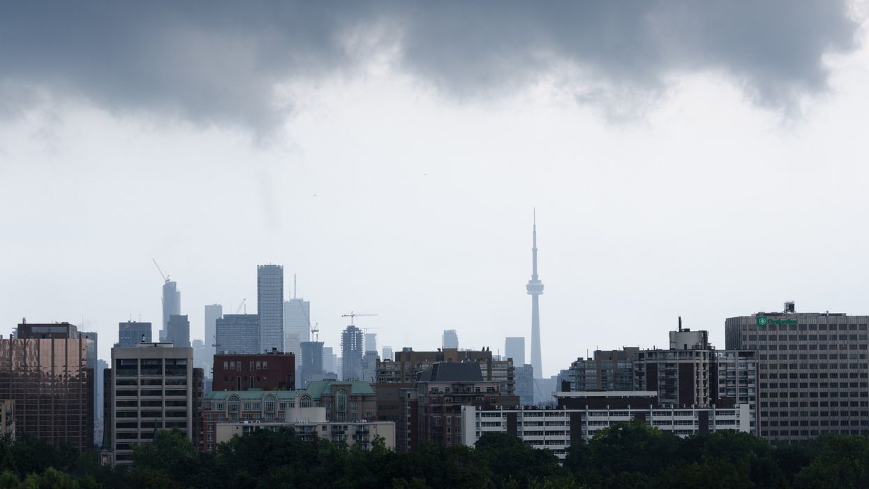 Toronto skyline on a gloomy, rainy day (illustrative).