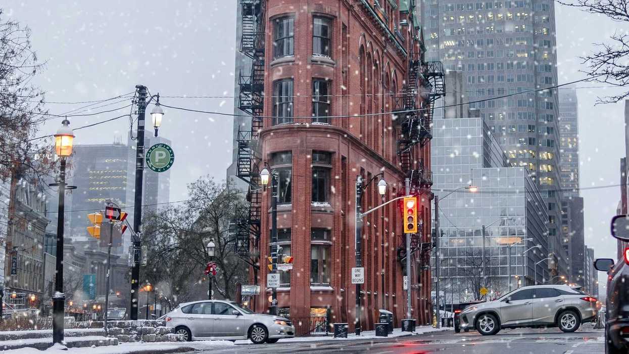 toronto street with cars during light snowfall