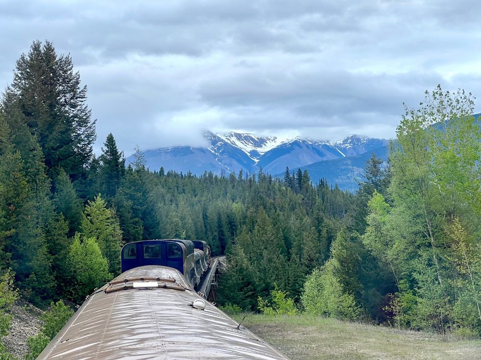 Train travelling through mountains.