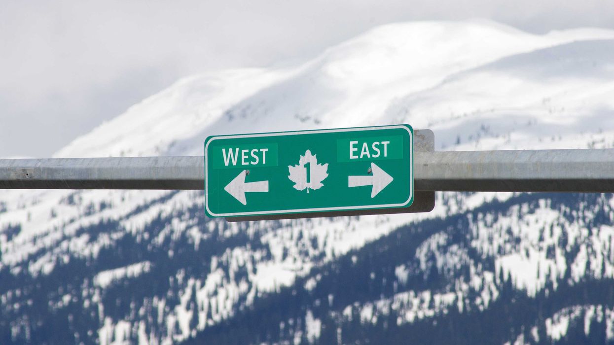 Trans Canada Highway sign with arrows pointing west and east.