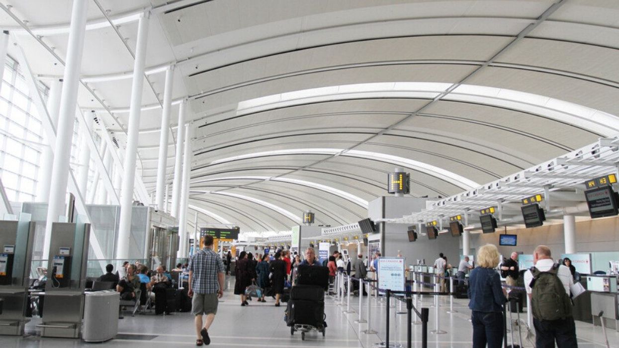 Travellers at Toronto Pearson Airport.