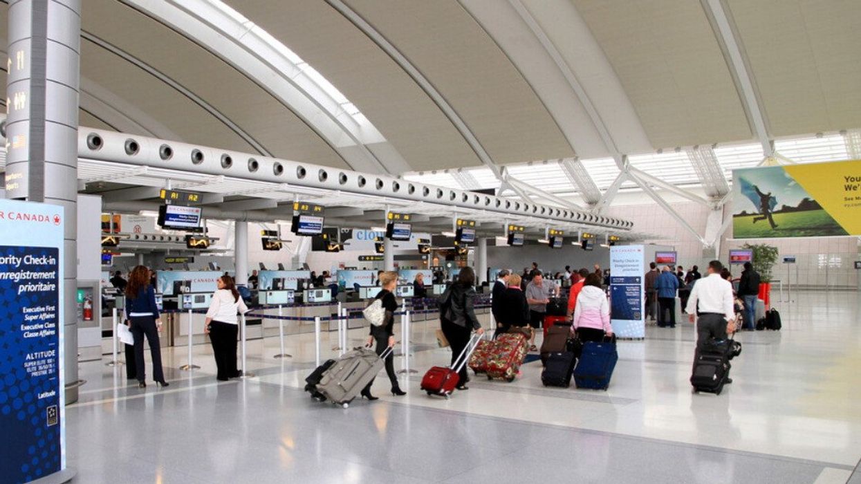 Travellers at Toronto Pearson Airport.