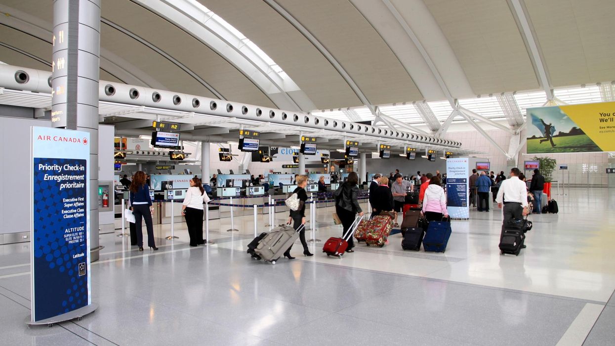 Travellers at Toronto Pearson International Airport.