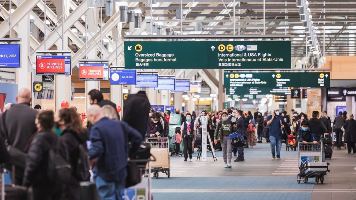 Travellers at Vancouver International Airport.
