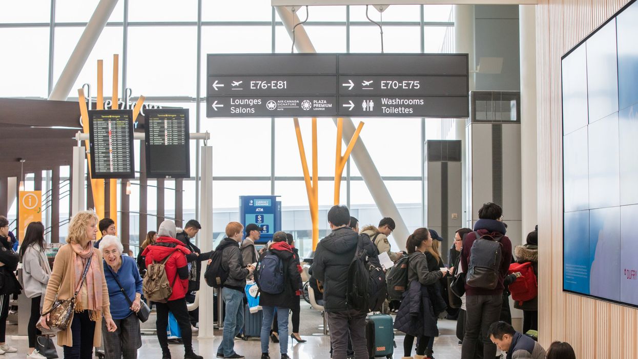 Travellers line up in Terminal 1 at Toronto Pearson International Airport.
