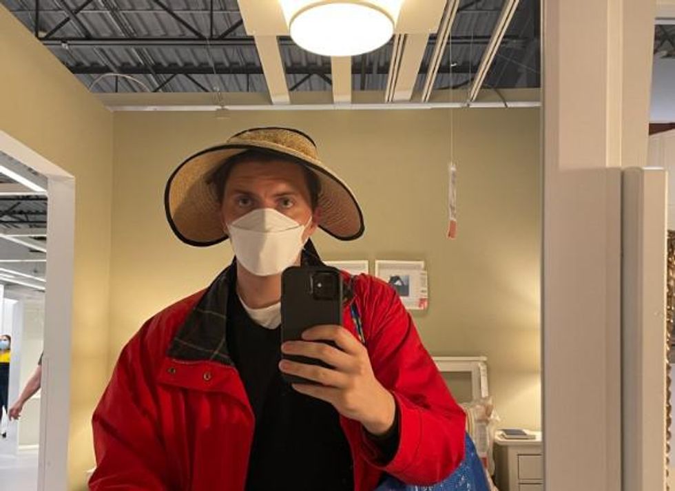 Tristan Wheeler wearing a straw hat he found.