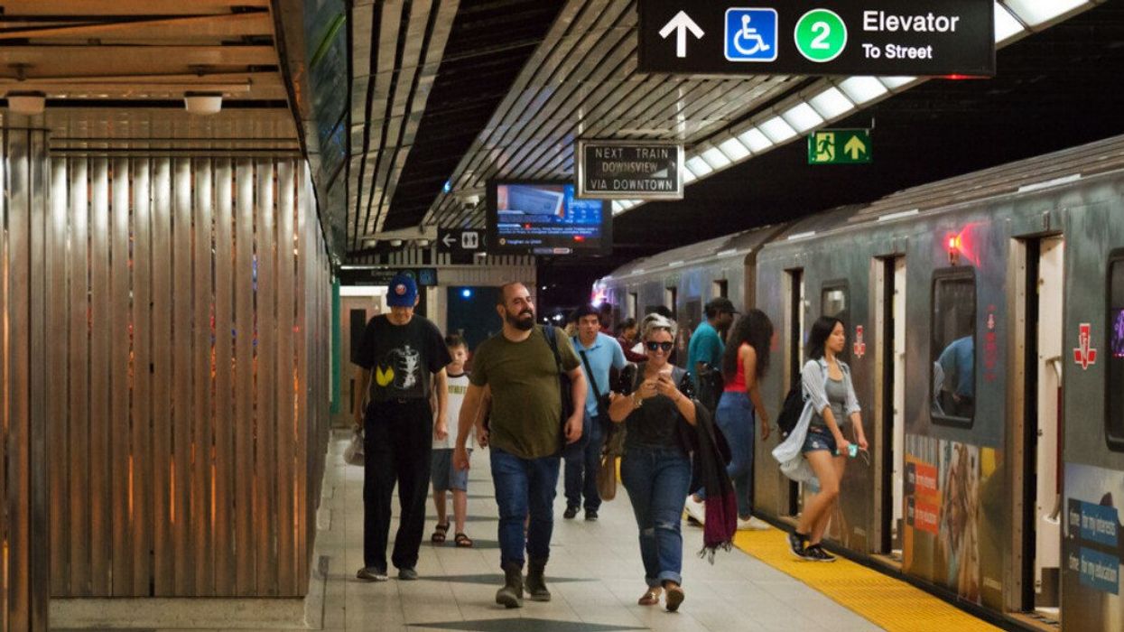 TTC riders entering and exiting a subway.
