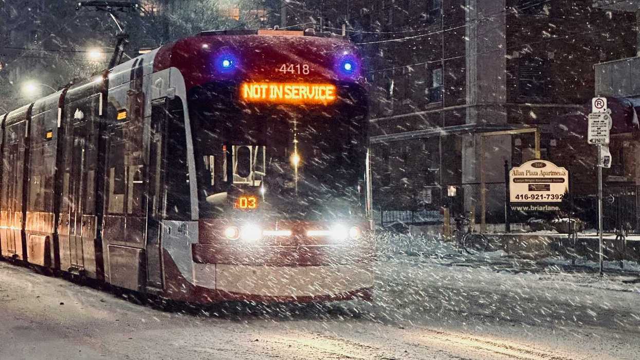 ttc streetcar on toronto street during snowstorm