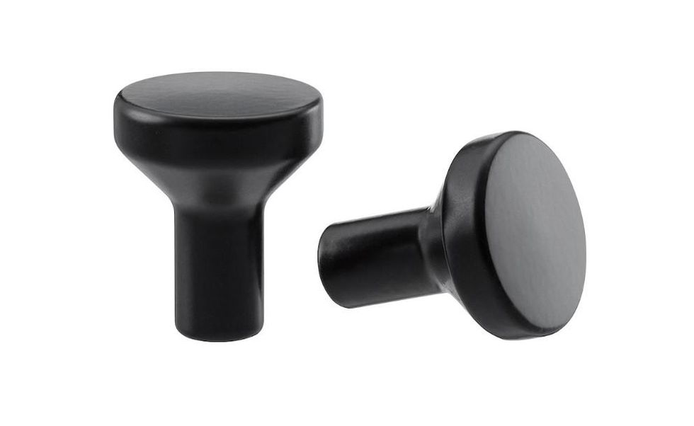 Two black door knobs.