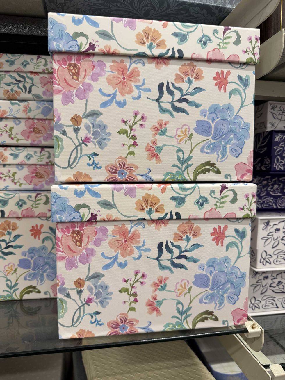 Two boxes stacked on top of each other with colours on them.