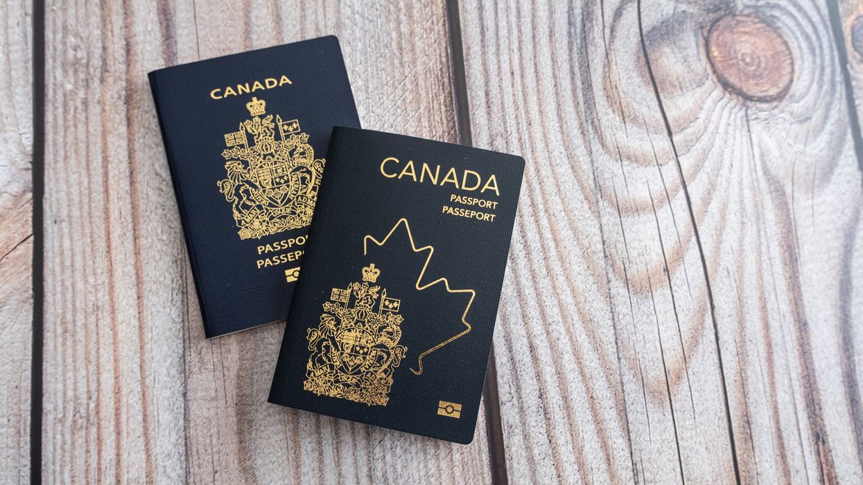 two canadian passports, inclduing the newer version