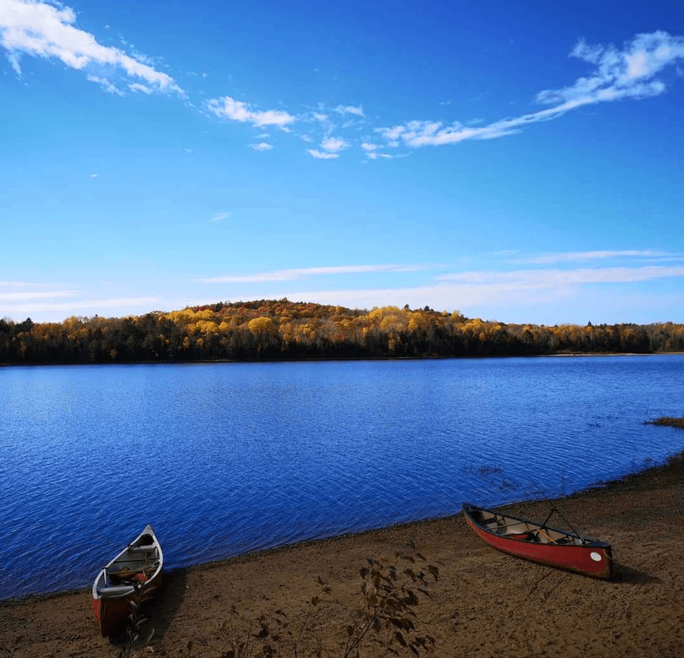 Two canoes by a lake in Ontario.