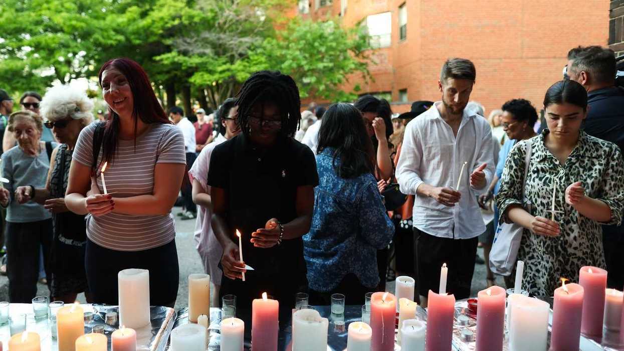 Two charged in fatal festival shooting